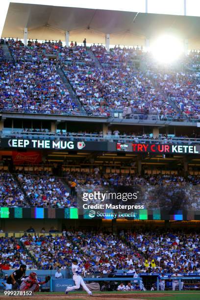 Enrique Hernandez of the Los Angeles Dodgers at bat during the MLB game against the Los Angeles Angels at Dodger Stadium on July 14, 2018 in Los...