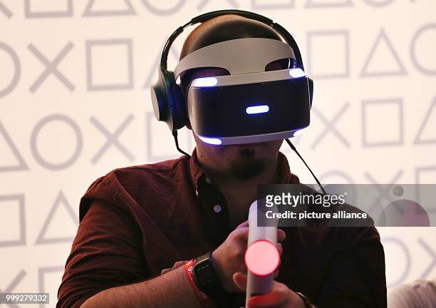 Video gamer tests VR glasses at the Gamescom in Cologne, Germany, 22 August 2017. German Chancellor Merkel opened the video gaming fair Gamescom ....