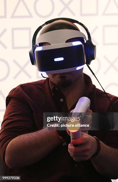 Video gamer tests VR glasses at the Gamescom in Cologne, Germany, 22 August 2017. German Chancellor Merkel opened the video gaming fair Gamescom ....