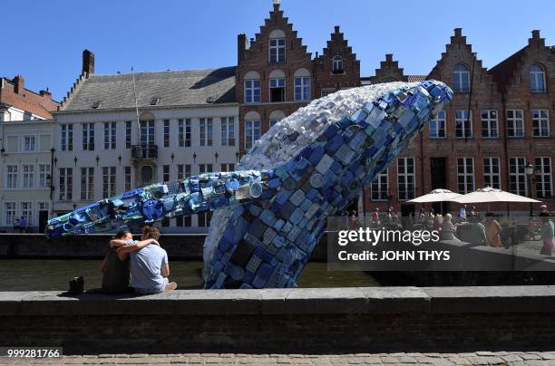 Metre installation depicting a whale, made up of five tons of plastic waste pulled out of the Pacific Ocean, is displayed in Brugges, on July 14,...