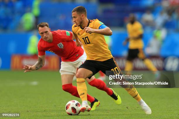 Eden Hazard of Belgium battles with Phil Jones of England during the 2018 FIFA World Cup Russia 3rd Place Playoff match between Belgium and England...