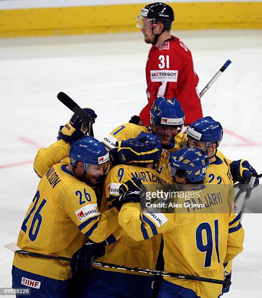 Victor Hedman of Sweden celebrates his team's third goal with team mates during the IIHF World Championship group E qualification round match between...