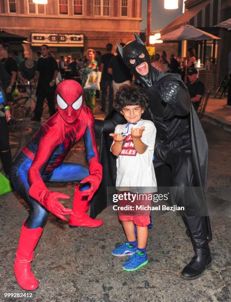 Spiderman and Batman pose at Concern Foundations's 44th Annual Block Party at Paramount Studios on July 14, 2018 in Hollywood, California.