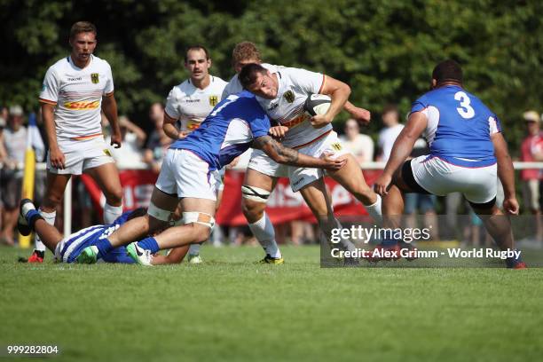 Mathieu Ducau of Germany is challenged by Jack Lam of Samoa during the Germany v Samoa Rugby World Cup 2019 qualifying match on July 14, 2018 in...