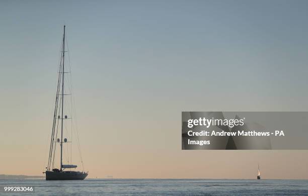 Sailing boat moored in Southampton Water as the sun rises