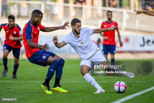 Kouadio Yves Dabila of Lille and Youness Aouladzian of Reims during the friendly match between Lille and Reims on July 14, 2018 in St Quentin, France.