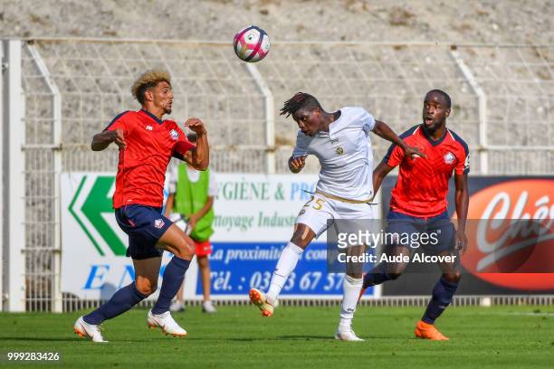 Kevin Malcuit of Lille, Moussa Doumbia of Reims and Jonathan Ikone of Lille during the friendly match between Lille and Reims on July 14, 2018 in St...