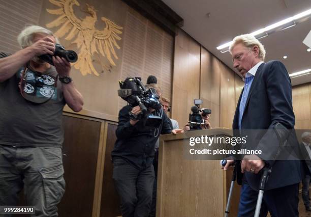 German former professional tennis player Boris Becker arriving in crutches to a press conference by the German Tennis Federation at Romerberg in...