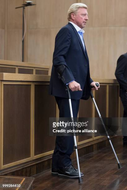 German former professional tennis player Boris Becker arriving in crutches to a press conference by the German Tennis Federation at Romerberg in...
