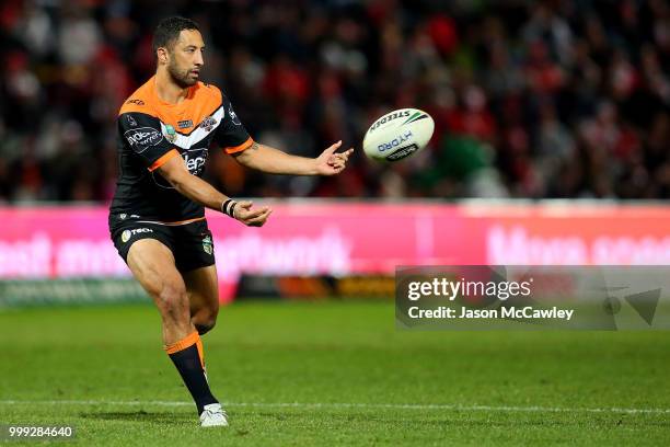 Benji Marshall of the Tigers passes the ball during the round 18 NRL match between the St George Illawarra Dragons and the Wests Tigers at UOW...