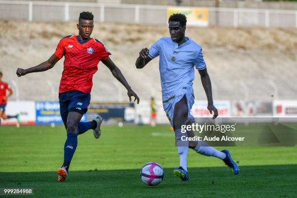 Edgar Miguel Ie of Lille and Boulaye Dia of Reims during the friendly match between Lille and Reims on July 14, 2018 in St Quentin, France.