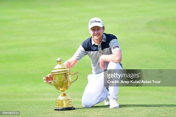 Justin Harding of South Africa pose with the trophy after winning the Bank BRI Indonesia Open at Pondok Indah Golf Course on July 15, 2018 in...