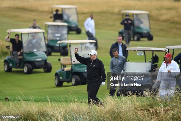 President Donald Trump waves whilst playing a round of golf at Trump Turnberry Luxury Collection Resort during the U.S. President's first official...