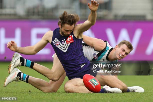 Joel Hamling of the Dockers and Douglas Howard of the Power contest for the ball during the round 17 AFL match between the Fremantle Dockers and the...