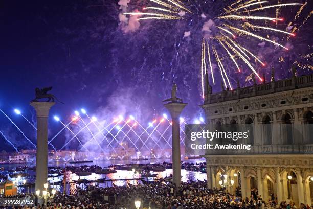 The fireworks display on the San Marco basin, seen from the Palazzo Ducale loggia, on the occasion of the traditional feast of the Holy redeemer on...