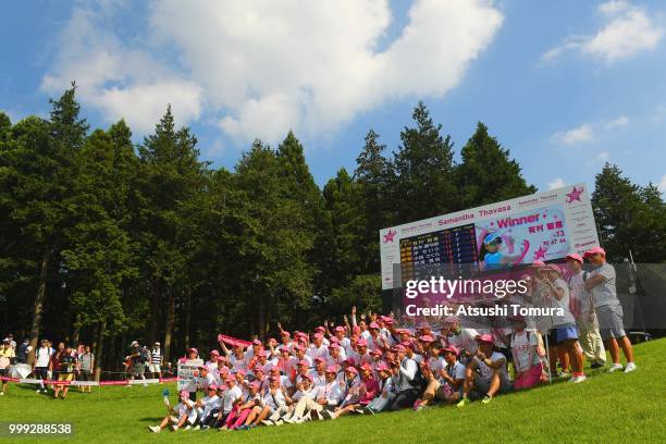 Chie Arimura of Japan poses with event staffs after winning the Samantha Thavasa Girls Collection Ladies Tournament at the Eagle Point Golf Club on...