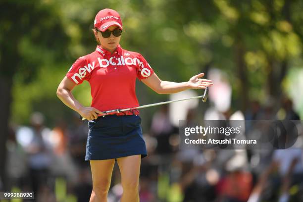 Chie Arimura of Japan lines up her putt on the 15th hole during the final round of the Samantha Thavasa Girls Collection Ladies Tournament at the...