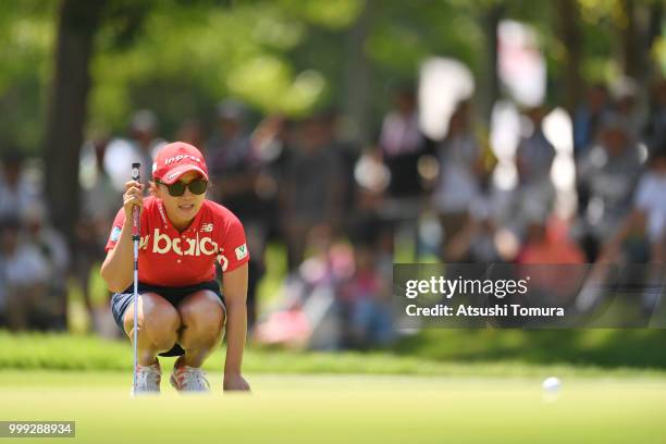 Chie Arimura of Japan lines up her putt on the 15th hole during the final round of the Samantha Thavasa Girls Collection Ladies Tournament at the...