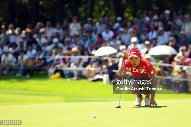 Chie Arimura of Japan lines up her putt on the 18th hole during the final round of the Samantha Thavasa Girls Collection Ladies Tournament at the...