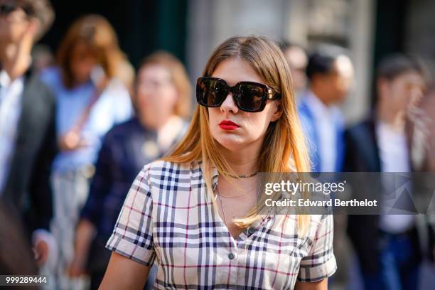 Guest wears Gucci sunglasses, a tartan checked outfit, outside Dior, during Paris Fashion Week - Menswear Spring-Summer 2019, on June 23, 2018 in...