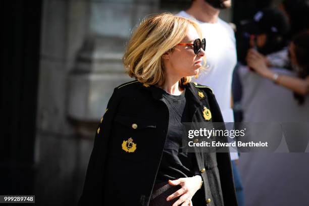 Guest wears a military blazer jacket, outside Dior, during Paris Fashion Week - Menswear Spring-Summer 2019, on June 23, 2018 in Paris, France.