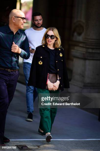Guest wears a military blazer jacket, green pants, outside Dior, during Paris Fashion Week - Menswear Spring-Summer 2019, on June 23, 2018 in Paris,...