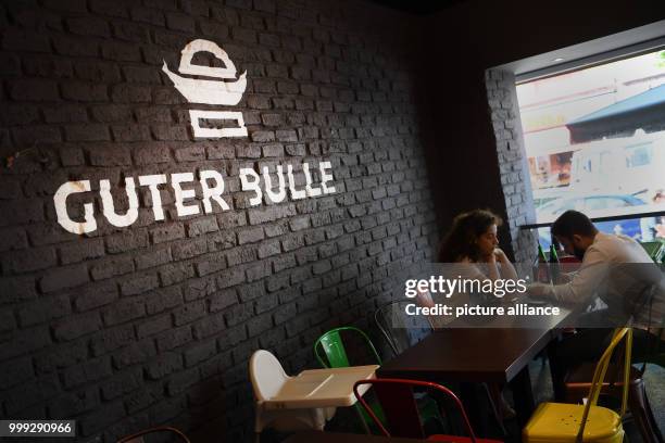 Lettering reads "Guter Bulle" on the wall of a burger restaurant of the same name in Frankfurt am Main, Germany, 23 August 2017. The small burger...