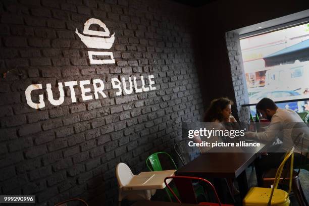 Lettering reads "Guter Bulle" on the wall of a burger restaurant of the same name in Frankfurt am Main, Germany, 23 August 2017. The small burger...