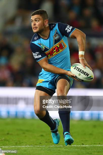 Ash Taylor of the Titans passes during the round 18 NRL match between the Gold Coast Titans and the Sydney Roosters at Cbus Super Stadium on July 15,...