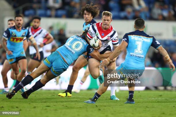 Lindsay Collins of the Roosters runs the ball during the round 18 NRL match between the Gold Coast Titans and the Sydney Roosters at Cbus Super...