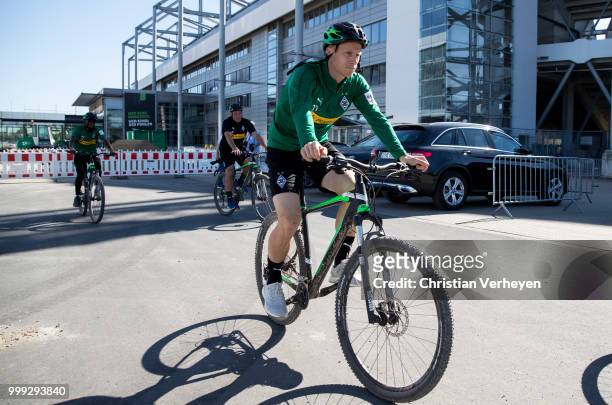 Oscar Wendt go by bike during a training session of Borussia Moenchengladbach at Borussia-Park on July 15, 2018 in Moenchengladbach, Germany.