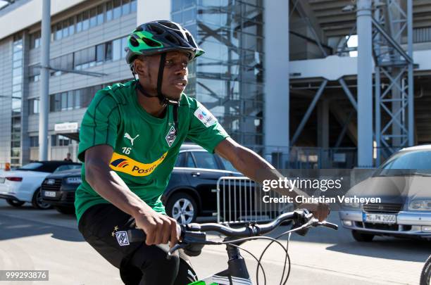 Ibrahima Traore go by bike during a training session of Borussia Moenchengladbach at Borussia-Park on July 15, 2018 in Moenchengladbach, Germany.