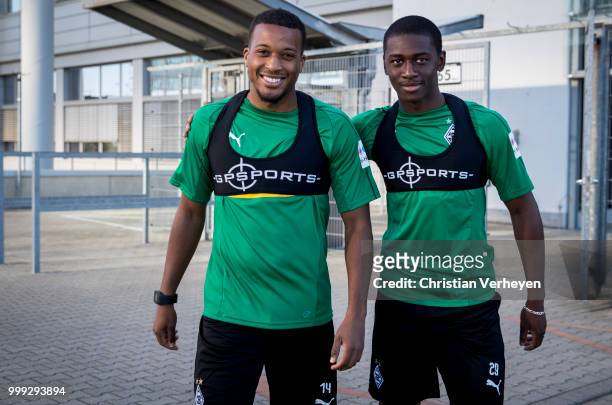 Alassane Plea and Mamadou Doucoure ahead a training session of Borussia Moenchengladbach at Borussia-Park on July 15, 2018 in Moenchengladbach,...