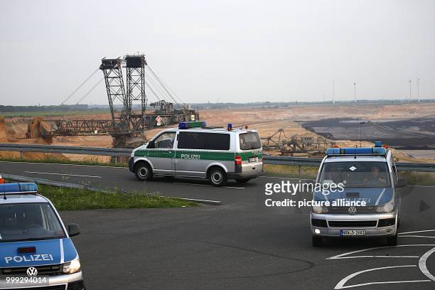 Police vehicles on stand-by on the edges of the Garzweiler surface mine near Erkelenz, Germany, 24 August 2017. No protests have been reported yet at...