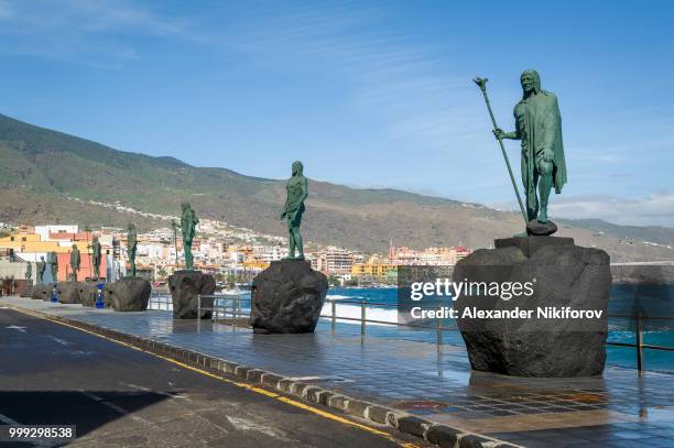 guanches statues at candelaria embankment - guanches stock-fotos und bilder