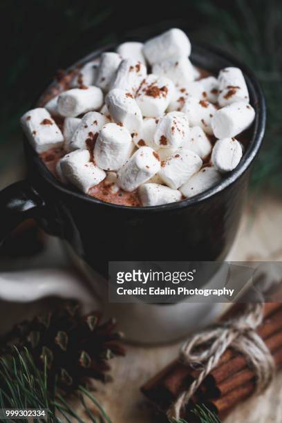 new year and christmas concept. hot chocolate with marshmallow in a clay black and white mug on... - black christmas stockfoto's en -beelden