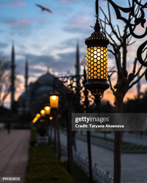 blue mosque sultan ahmed silhouette with lanterns at sunset - sultan mosque stock pictures, royalty-free photos & images