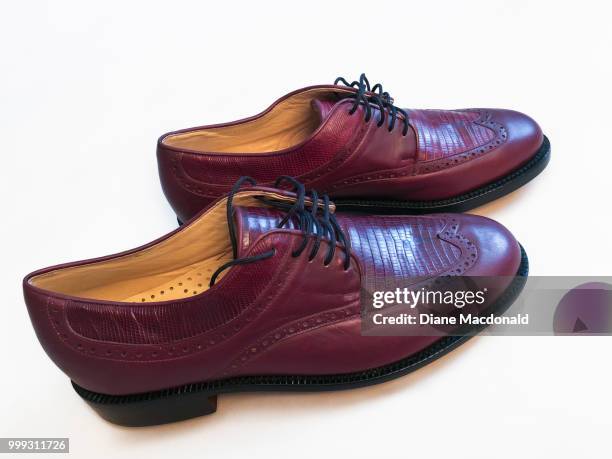 a pair of men’s golf shoes - crocodile leather stock pictures, royalty-free photos & images