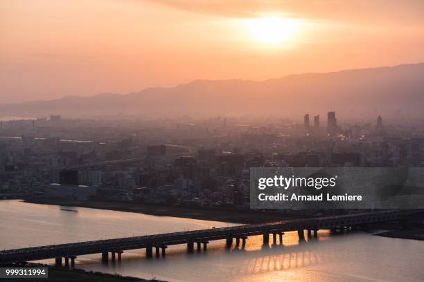 sunset over osaka - arnaud stock pictures, royalty-free photos & images