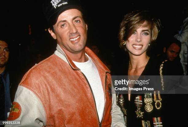 Sly Stallone and Jennifer Flavin attend the Grand Opening of Planet Hollywood on October 22, 1991 in New York City.