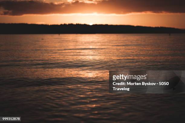 sunset at english bay, vancouver - english bay stock pictures, royalty-free photos & images