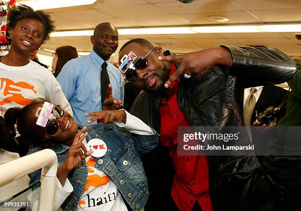 Wyclef Jean and Farah Maurice attend a charity shopping spree at Kmart on May 18, 2010 in New York City.