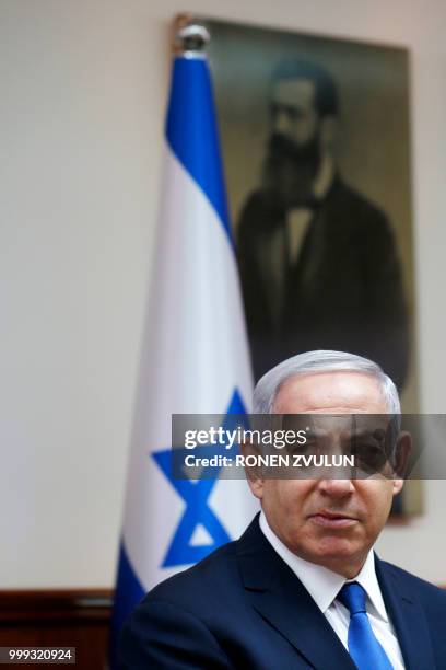 Israeli Prime Minister Benjamin Netanyahu attends the weekly cabinet meeting at his office in Jerusalem on July 15, 2018.