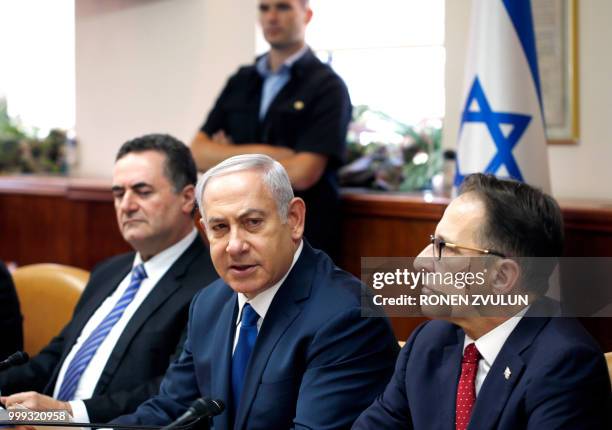 Israeli Prime Minister Benjamin Netanyahu speaks during the weekly cabinet meeting at his office in Jerusalem on July 15 accompanied by Cabinet...