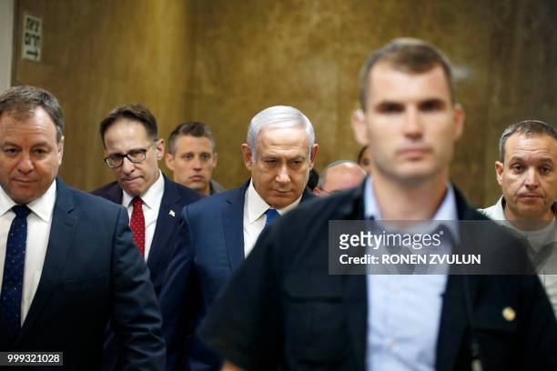 Israeli Prime Minister Benjamin Netanyahu arrives to the weekly cabinet meeting at his office in Jerusalem on July 15, 2018.