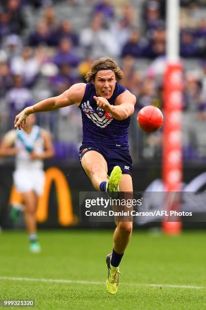 Ed Langdon of the Dockers kicks the ball during the 2018 AFL round 17 match between the Fremantle Dockers and the Port Adelaide Power at Optus...