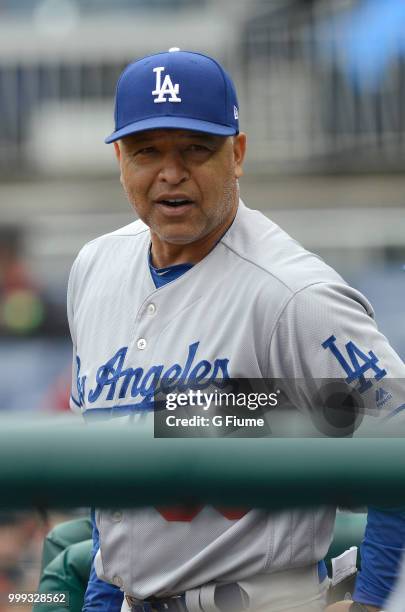 Manager Dave Roberts of the Los Angeles Dodgers watches the game against the Washington Nationals at Nationals Park on May 19, 2018 in Washington, DC.