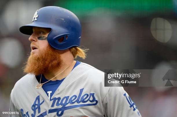 Justin Turner of the Los Angeles Dodgers walks to the dugout during the game against the Washington Nationals at Nationals Park on May 19, 2018 in...