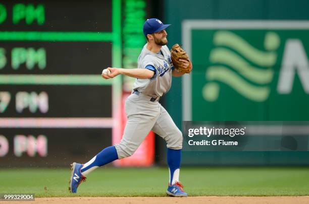 Chris Taylor of the Los Angeles Dodgers throws the ball to first base against the Washington Nationals at Nationals Park on May 19, 2018 in...