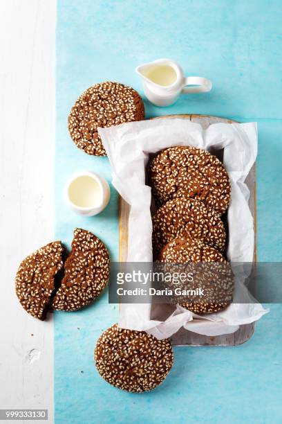 chocolate oat cookies with sesame on top - buckwheat isolated stock pictures, royalty-free photos & images